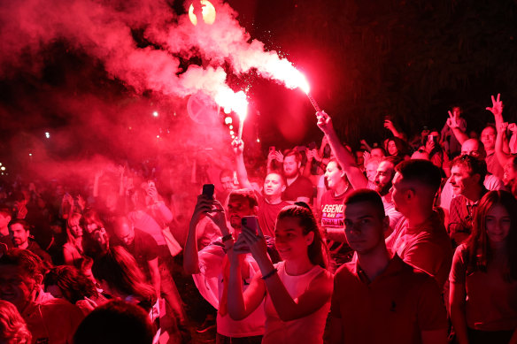 Djokovic fans light flares as part of the celebrations in Belgrade.