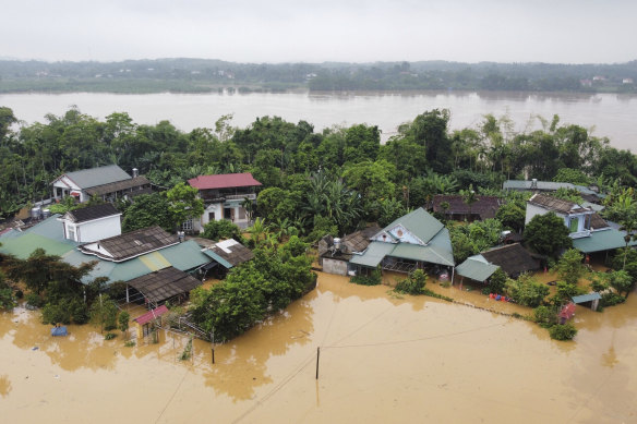 A flood triggered by Typhoon Yagi submerges houses in Phu Tho province, Vietnam.