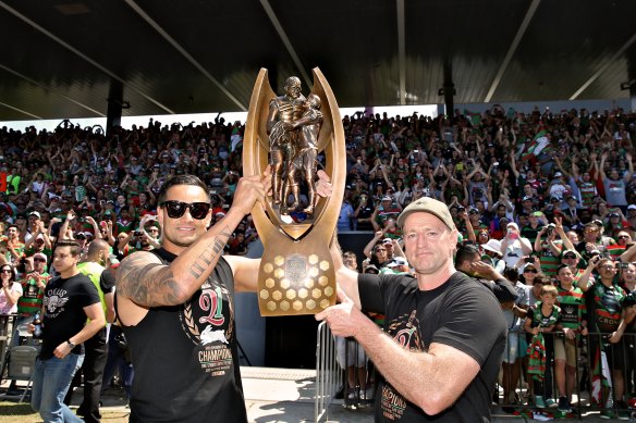 John Sutton and Michael Maguire celebrate the 2014 title with fans at Redfern Oval.