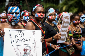 Papuan students, their faces painted in the colours of the banned Morning Star flag, protest in Jakarta on August 28. 