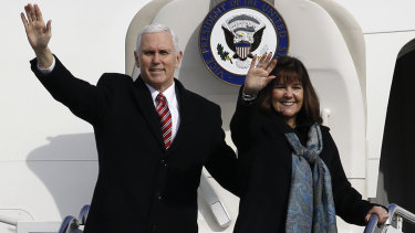 US Vice-President Mike Pence, left, and his wife Karen wave as they depart for South Korea. The US doesn't want the Games to be 'hijacked by North Korean propaganda'.
