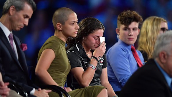Marjory Stoneman Douglas High School student Emma Gonzalez comforts a classmate during a CNN town hall meeting on Wednesday.
