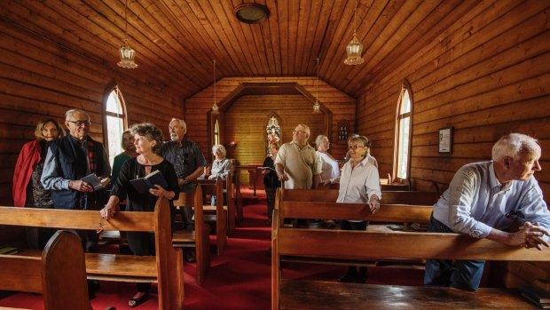 Parishioners inside St Aidan's Anglican church, Black Springs.