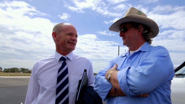 Campbell Newman chats with LNP colleague Vaughan Johnson at Emerald airport.