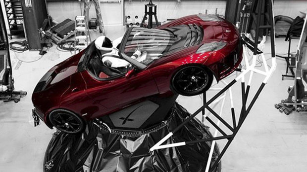 A mannequin “Starman” sits at the wheel of a Tesla Roadster which was sent into space.