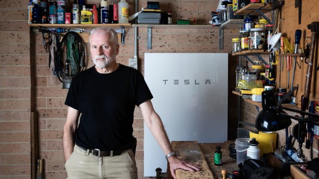 Home owner Peter Youll with his Tesla home battery.