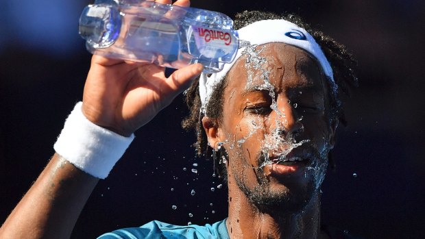 France's Gael Monfils showers himself with water during the recent Australian Open.