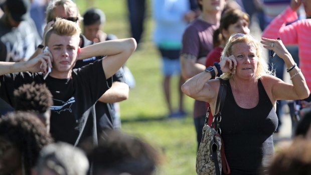 Anxious family members gather south of campus following the shooting.