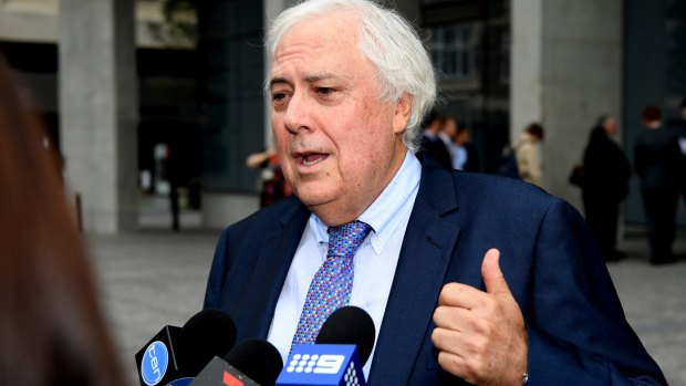 Businessman and former federal MP Clive Palmer, addresses the media at the Supreme Court, in Brisbane.
