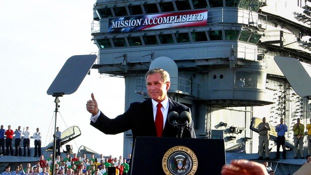President Bush flashes a "thumbs-up" after declaring the end of major combat in Iraq as he speaks aboard the aircraft carrier USS Abraham Lincoln off the California coast, ons May 1, 2003.