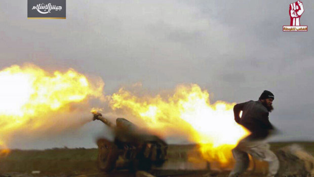 A photo posted by the Syrian insurgent group Army of Islam, shows a fighter during clashes with government forces in the southern province of Daraa, Syria. 