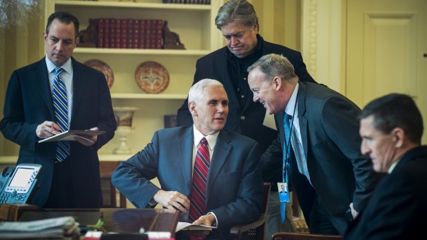 Seven out of 12 top staff have left, including every person surrounding Vice President Mike Pence in this 2017 photo. 