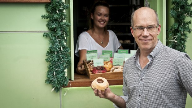 Damian Griffiths, the founder of Doughnut Time, with one of his $6 doughnuts.
