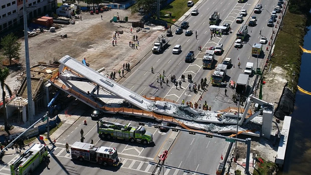 A DroneBase photo shows the collapsed pedestrian bridge at Florida International University.