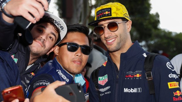 Red Bull's Daniel Ricciardo poses with fans ahead of the Australian Grand Prix.