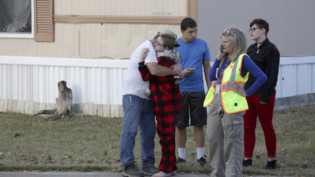Ron Lawrence, left, comforts his daughter Kallie Lawrence, 11, who knew the  boy that was killed in the shoot out between Bexar County Deputies and a wanted suspect woman in Pecan Grove Trailer Park in Schertz, Texas.</p>
<p>