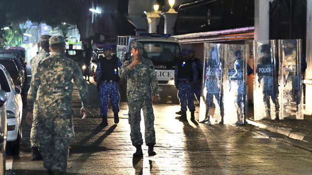 Maldives defence soldiers patrol on the main street of Male, Maldives.