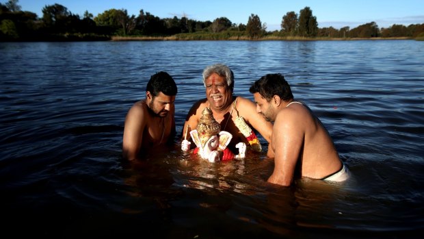 The Hindu community pays homage to the deity Ganesha in the Georges River at Chipping Norton, near Liverpool.
