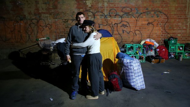 A homeless couple after they were evicted from their makeshift camp in Melbourne in June 2016.