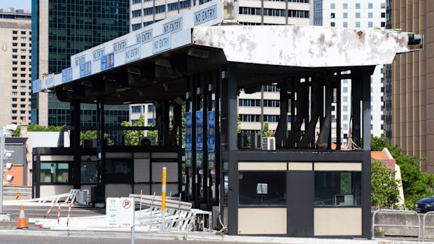 The cash toll booths at the southern end of the bridge stood idle for about eight years before they were removed.