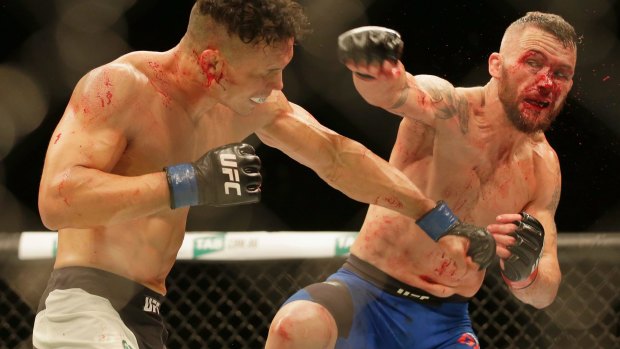  Jon Tuck, left, and Damien Brown fight during UFC Fight Night at Rod Laver Arena.