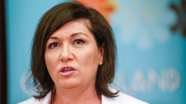 Leeanne Enoch has called for LNP candidate Kerri-Anne Dooley to be axed over the offensive photo.