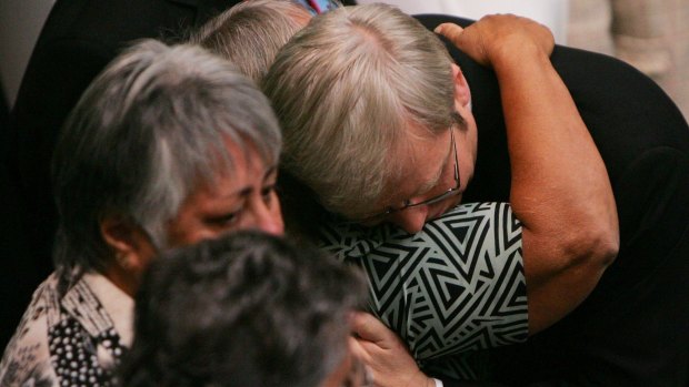 Kevin Rudd hugs guests after his apology to Indigenous Australians.