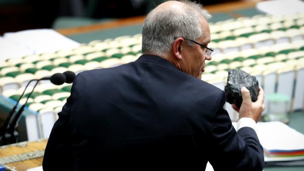 Federal Treasurer Scott Morrison shows off a lump of black coal during question time last year.