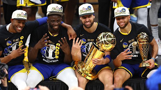 Andre Iguodala, Draymond Green, Klay Thompson and Stephen Curry  of the Golden State Warriors after claiming the NBA championship for a  fourth time.