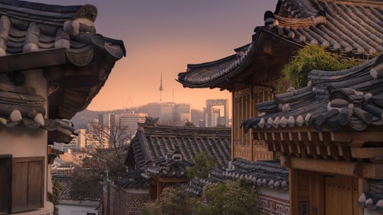 Bukchon Hanok village with Seoul city background