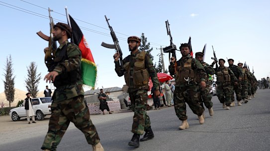Afghan militiamen join Afghan defense and security forces in Kabul.