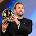 Harry Kane holds aloft the Ballon d’Or trophy.