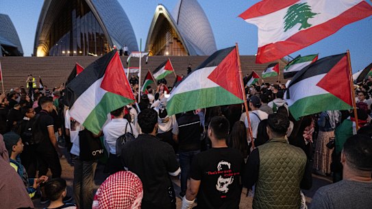 Palestinian supporters gathered outside the Opera House on October 9 after it was lit up in Israeli colours following the Hamas attack.