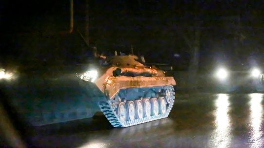 An armoured vehicle rolls down a street outside Donetsk, the territory controlled by pro-Russian militants, eastern Ukraine, late Tuesday, February 22. 