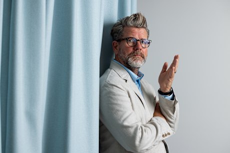 Tim Ross loves his suits that were designed by his wife, Michelle Glew-Ross. 