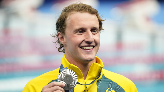 Elijah Winnington proudly displays his silver medal.