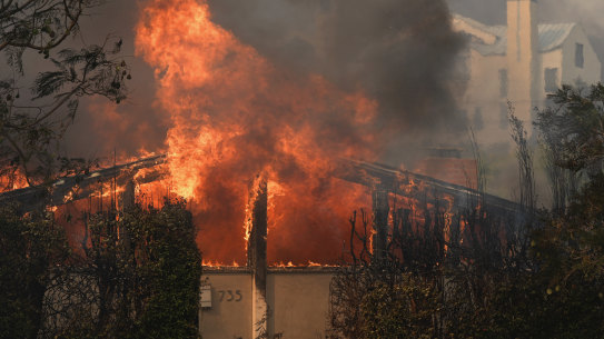 Fire ravages a Pacific Palisades neighbourhood amid high winds in Los Angeles.