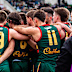 Tassie Devils players huddle in the VFL.
