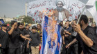 Iranians burn a representation of the Israeli flag during the funeral ceremony of Hamas leader Ismail Haniyeh and his bodyguard who were killed in an assassination blamed on Israel.