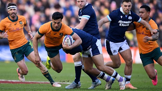 Joseph-Aukuso Suaalii attacks the Scottish line.