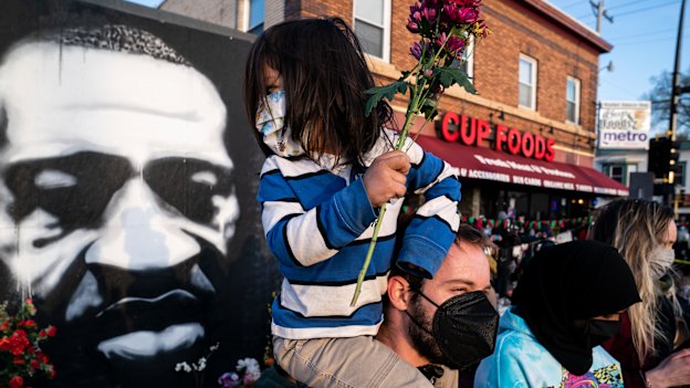 People gather outside Cup Foods in Minneapolis to celebrate the murder conviction of former police Officer Derek Chauvin in the killing of George Floyd.