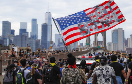 Protesters march on Brooklyn Bridge after a rally in New York following the death of George Floyd, 2020.