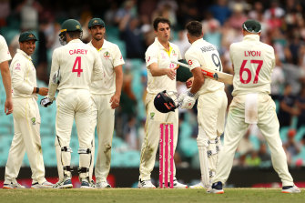 Pat Cummins and Jimmy Anderson shake hands after the fourth Test.