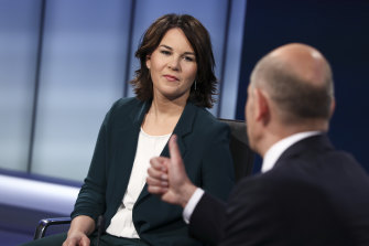 German Green party co-leader Annalena Baerbock and German Finance Minister Olaf Scholz of the Social Democratic Party (SPD) attend a television debate in June.
