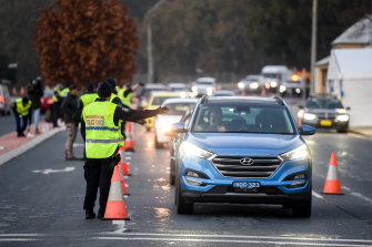NSW Police direct traffic at the Albury-Wodonga border last month.