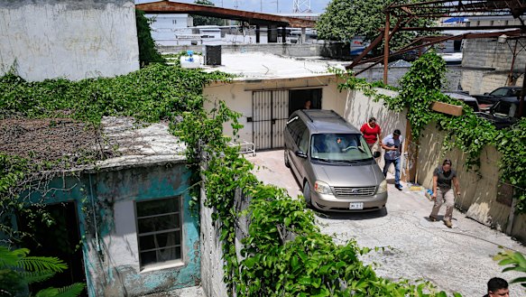 People accompanying the bodies of Salvadoran migrant Oscar Alberto Martinez Ramírez, 25, and his nearly two-year-old daughter Valeria leave after the coffins carrying the bodies were loaded into a car to begin their journey home to El Salvador.