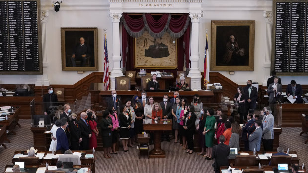 In May, Texas state representatives stand in the Texas House Chamber as they oppose a bill introduced that would allow private citizens to enforce an anti-abortion law  through civil lawsuits.