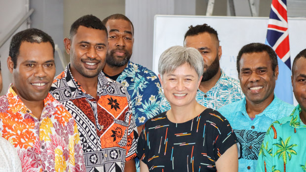 Penny Wong meets Australian-bound Fijian workers in Suva on Friday.