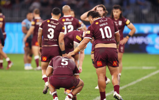 A dejected Selwyn Cobbo is comforted by Queensland teammate Josh Papalii. Both men need to lift dramatically for game three.