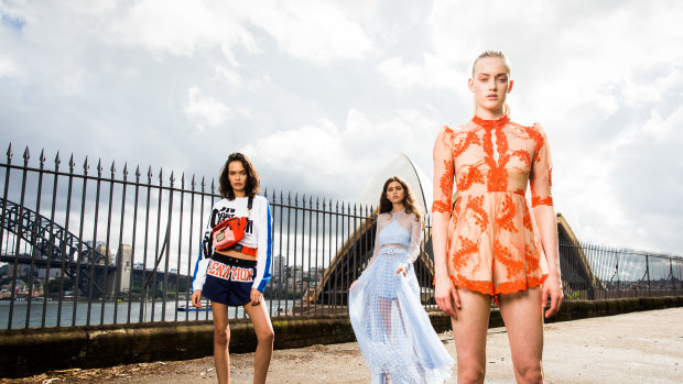 Models wear looks from designers showing at this year's MBFWA including Alice McCall, orange dress far right, We are Kindred, centre, and P.E Nation on the left. 
